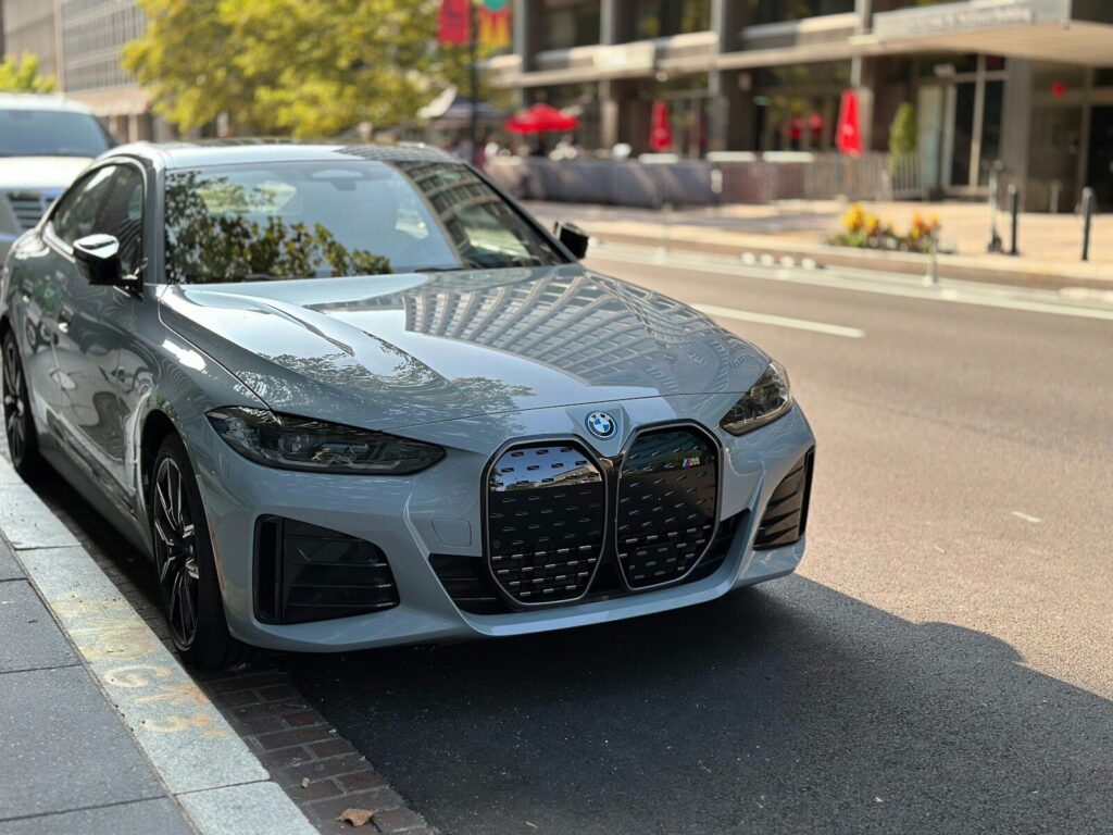 A silver car parked on the side of the road